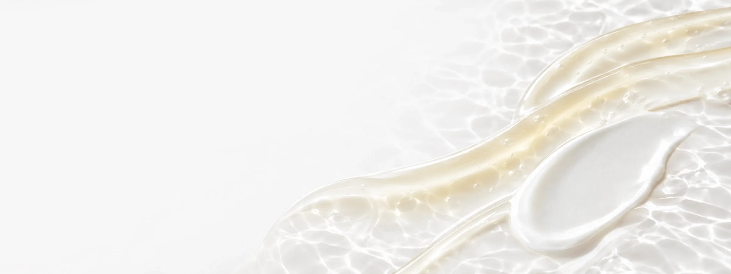 Luminous cream and serum textures representing Cible Skin for dark spots and radiance