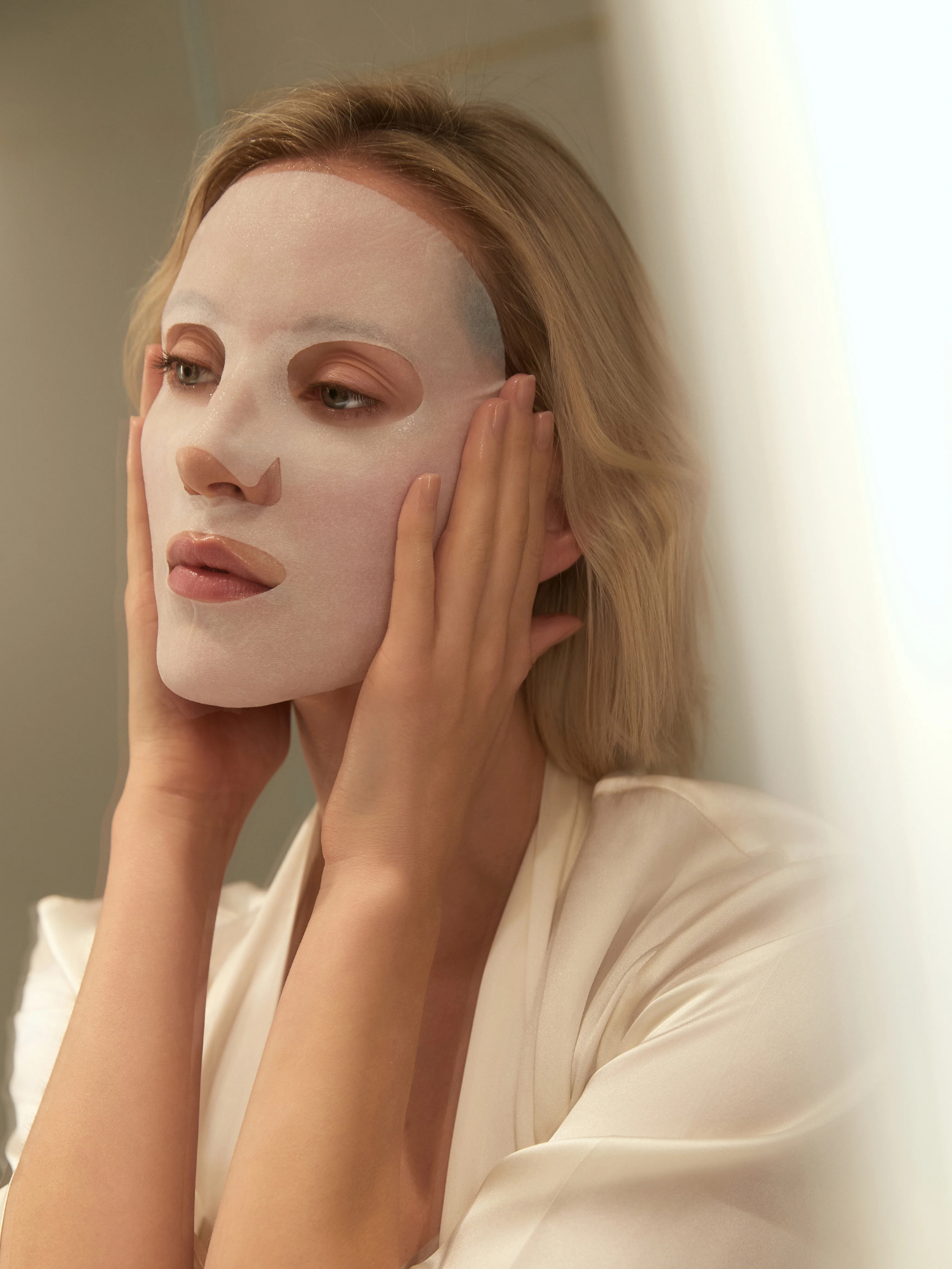 Woman wearing Cible Skin Post-Procedure hydrating face mask